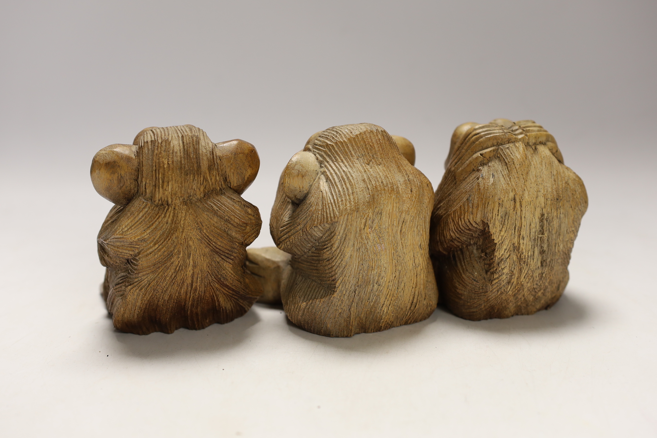 Three carved wood monkeys - hear no evil, see no evil and speak no evil, 10cm tall